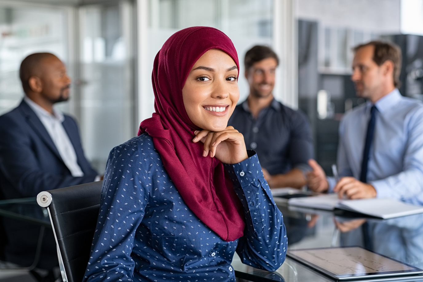 Woman Wearing Hijab in a Meeting with Colleagues